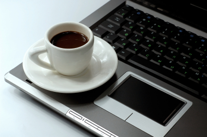 Cup of black coffee on a laptop business concept
